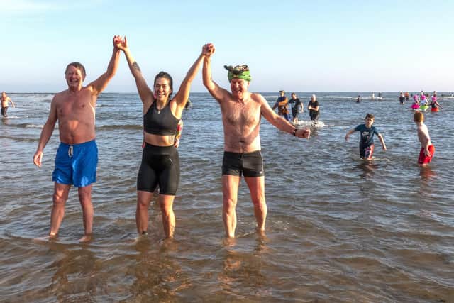 Participants emerging triumphant after the NewYear's Day Dip 2020 at Alnmouth beach. Picture by Jane Coltman