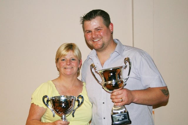 Amble Open Darts competition held at the Radcliffe Club in 2012. Winners of the ladies and men's trophies Colleen Hunt and James Forster