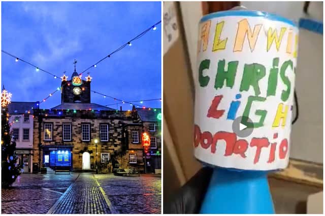 The fake collection boxes are blue, and say Alnwick Christmas Lights in bold colourful text.