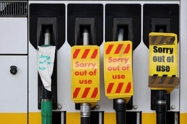 'Out of Use' signage is pictured on the petrol pumps of a closed fuel filling station. Picture by Adian Dennis, Getty
