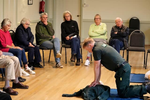Paul Brolly teaching CPR to local residents.