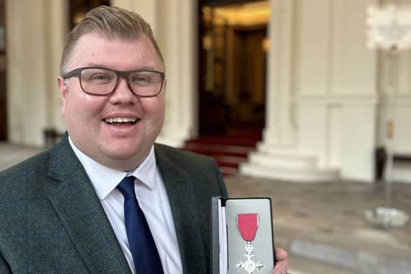 Scott Dickinson with his MBE.