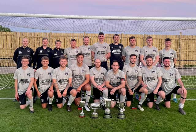 Amble proudly show of their haul of four trophies from their unbeaten season in the North Northumberland League.