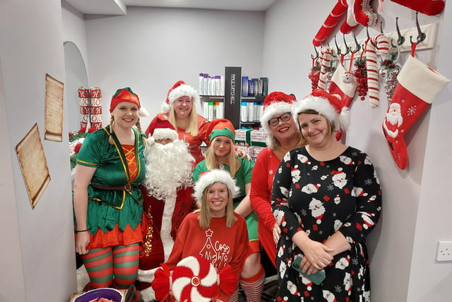 The team dressed up and handed out sweets and cupcakes before Santa was ready for visitors.