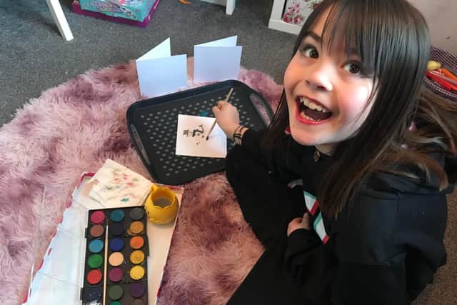 Rosie Parkin-Ross, 8, from Belford, raised funds for the homeless with her painted Christmas cards.
