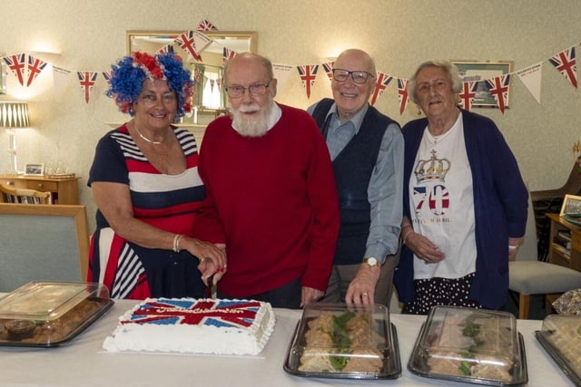Jubilee spirit was evident at Robert Adam Court – seen at the cake cutting are Sheila Moralee, Jim Askew, George Young and Mabel Forsyth.