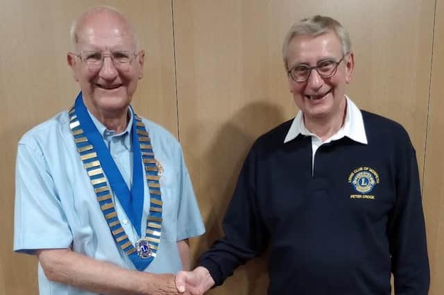 Peter Crook, right, passes the Chain of Office to Chris Offord at the Lions Club of Morpeth President handover.