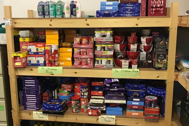 The well-stocked shelves of Alnwick District Food Bank with items ready to be put into Christmas hampers.