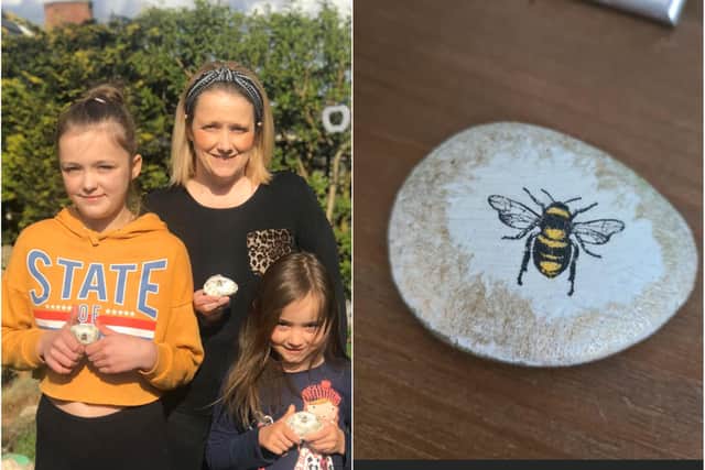Susannah Scott and daughters, Alice and Madelyn, have been painting stones for the local community.