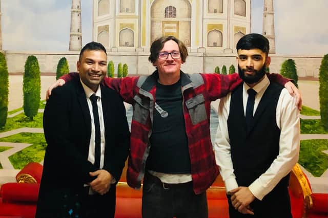 Oliul Khan, left, and his nephew Suleman with Ed Byrne, centre.