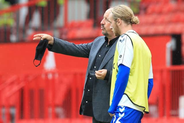Everton midfielder Tom Davies pictured alongside Rafa Benitez. (Photo by LINDSEY PARNABY/AFP via Getty Images)