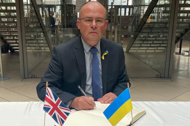 Blyth Valley MP Ian Levy signing the Ukraine Solidarity Book.