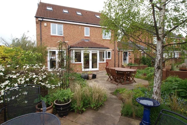 There is a mature ornamental enclosed garden, with decorative paving incorporating patio/sun terrace plus trees, garden pond, and timber summerhouse.