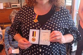 Dr Alice Good MBE with medal.