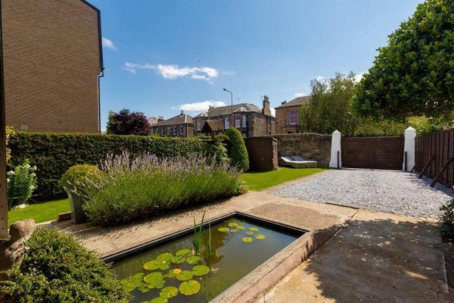 To the rear of the property, there’s a well-designed, pretty garden
