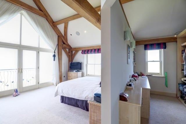The large main bedroom boasts a triple aspect with French doors with Juliet balcony and walk-in wardrobe.