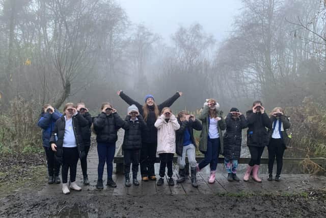 School children testing out binoculars as part of the Green Influncers Scheme