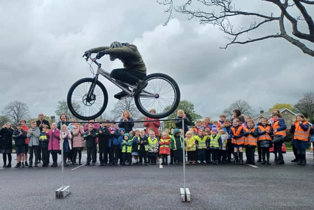 Pupils from Stannington First School received their Modeshift STARS platinum award following a display from the 3SIXTY bicycle stunt team.
