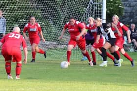 Action from the first ever ladies' match in the Charities Cup involving The Belles and The 274.