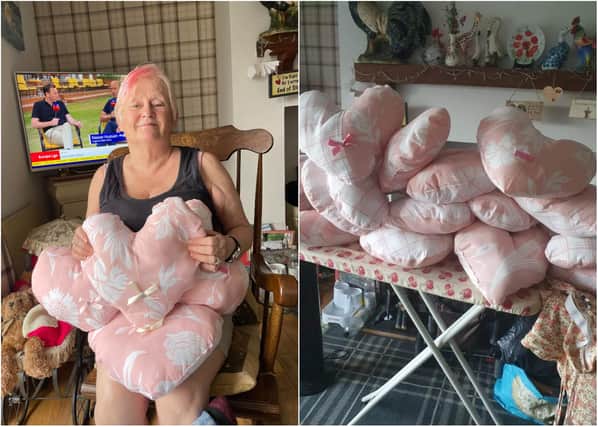 Christine Dobison with the cancer respite pillows she has made.