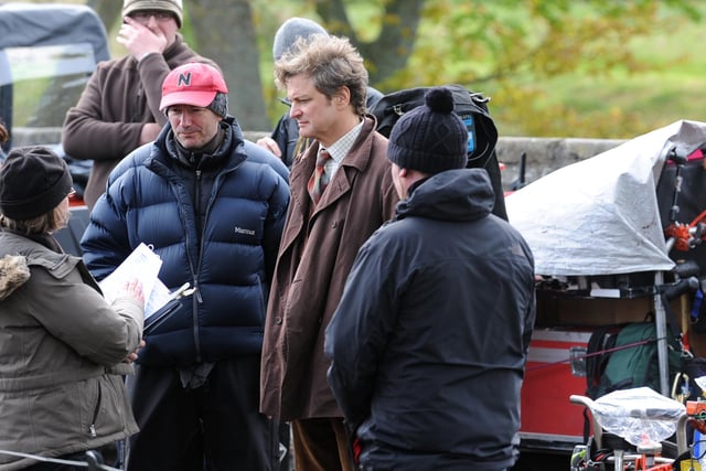 Colin Firth with crew on set.