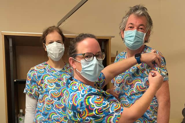 Dr Elizabeth Batley, advanced healthcare assistant Dawn Blackman and Dr Robert Lambourn wearing rainbow scrubs to signify a new hope.