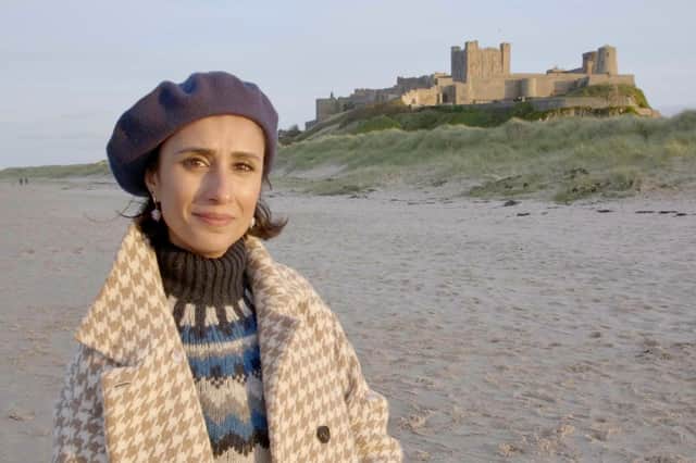Britain by Beach presenter Anita Rani at Bamburgh Castle.