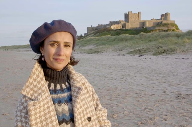 Britain by Beach presenter Anita Rani at Bamburgh Castle.