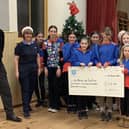 The Co-op Community Fund cheque presentation to the 4th Berwick Guides.