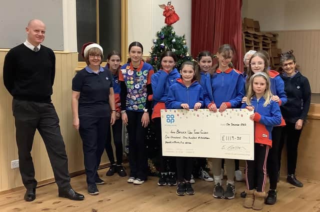 The Co-op Community Fund cheque presentation to the 4th Berwick Guides.