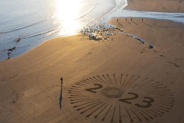 The sand was transformed into a New Year design.