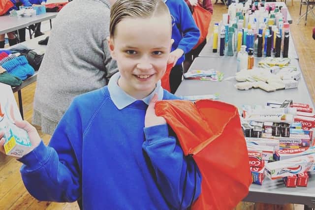 One of the St Aidan’s Catholic Primary School in Ashington pupils who helped to put together the Christmas packages.