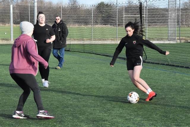 Jodie Kemp in action on the football pitch.