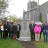 Friends and well-wishers at Andrew Blythe's restored grave.