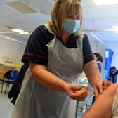 Clinical lead nurse Louise Frelford gives a Covid vaccination to a patient at Grindon Lane Primary Care Centre in Sunderland.