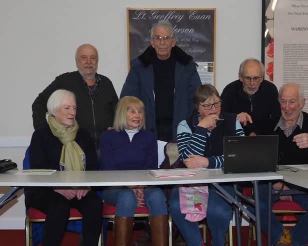 Hall Trustees looking at one of the new Chromebooks. From left to right they are Angela Mein, Peter Burnham, Sandie Saunders, John Lilley, Marion Jones, Tim Gray and Barry Jones.