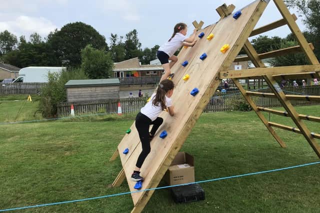 Children attempting a 'Challenge Northumberland' obstacle course.