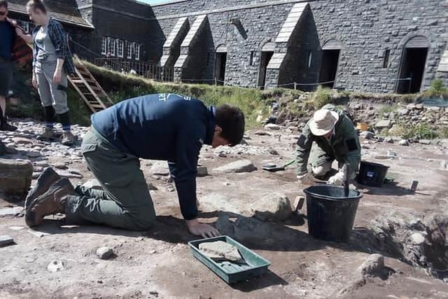 Archaeologists at work at Bamburgh Castle.