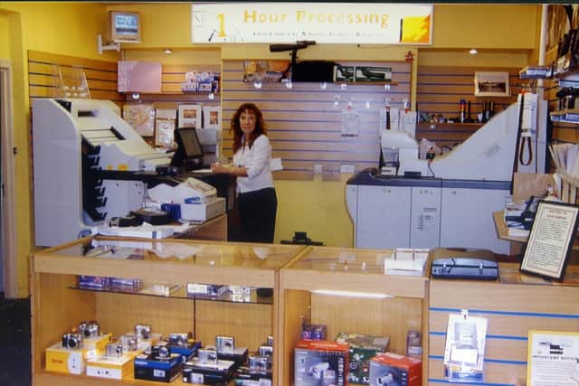 Doreen Ginger behind the counter at P D Quick in 1996.