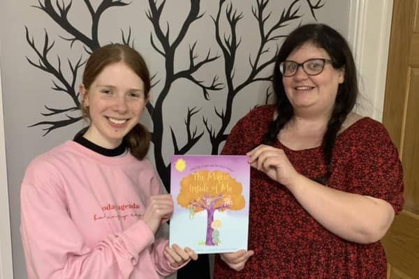 (L-R) Georgia Hutchinson and Holly Taylor hold up their new children's book named 'The Magic Inside of Me'.