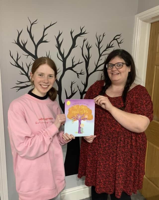 (L-R) Georgia Hutchinson and Holly Taylor hold up their new children's book named 'The Magic Inside of Me'.
