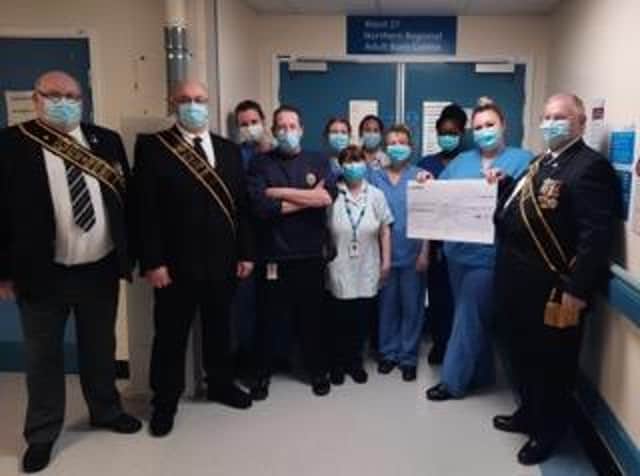 The Buffs hand over their generous donation to burns unit staff.