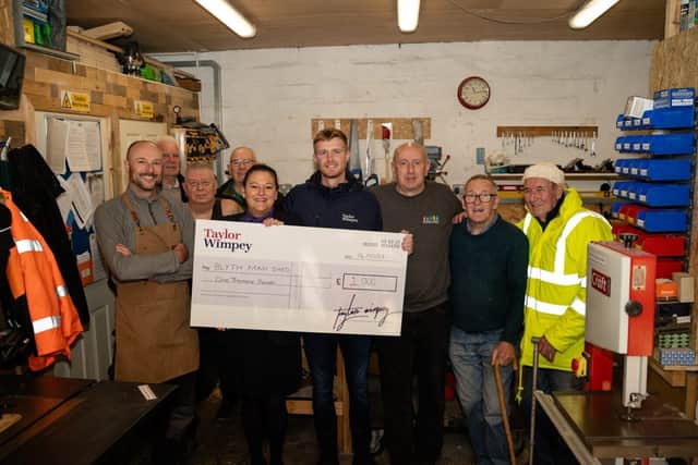 Blyth Man Shed members accept the donation from Taylor Wimpey North East. (Photo by Taylor Wimpey)