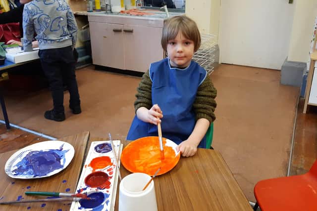Painting fun in the reception class.