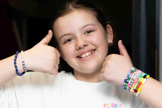 St AIdan's Primary school student Ruby Rae with her handmade bangles she is selling to raise money for Tiny Lives.