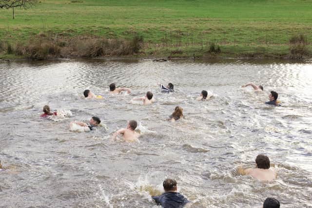 A dash to get the match ball across the River Aln. Picture: Mark Taff