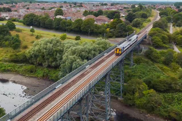 A Northern train crosses Bedlington railway bridge, which will be part of the Northumberland Line.