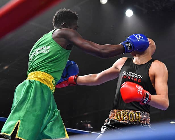 Adam Olaore lands a punch on Isaac Okoh on his way to becoming cruiserweight champion. Picture: Andy Chubb/England Boxing