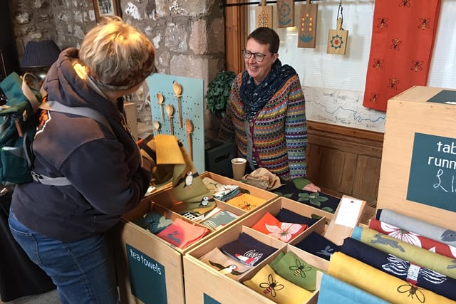 Nicola Couper of The Hare in Winter makes a sale of a table runner.