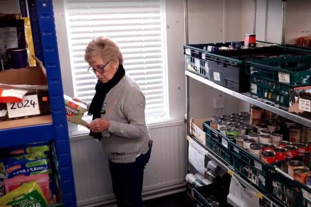 A volunteer prepares a food parcel at Cramlington Foodbank. Supplies of some items are running low, and the food bank now has to top up donations by spending cash reserves.